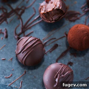 Bourbon Dark Chocolate Truffles on a blue surface, a sophisticated and boozy treat.