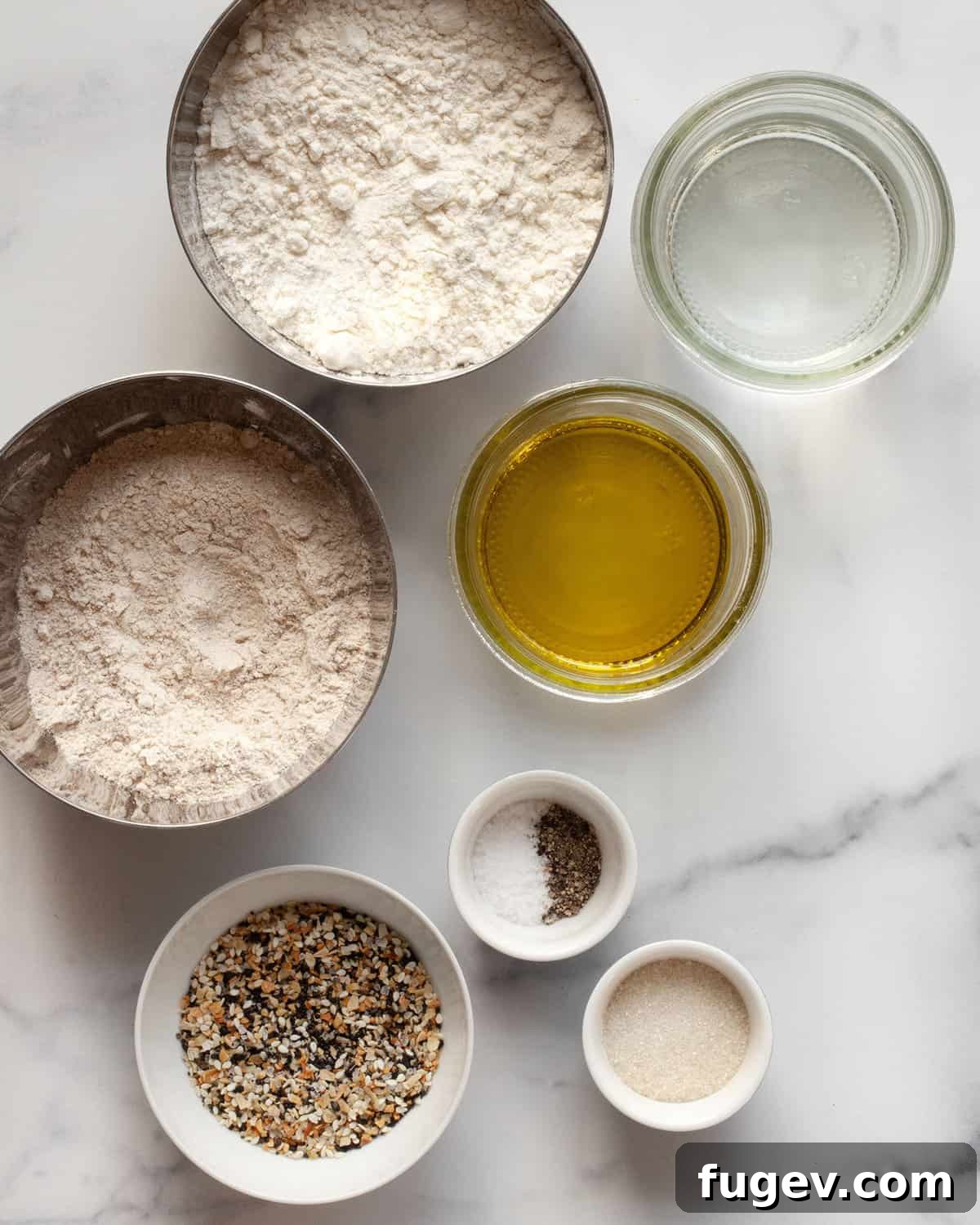 The Ultimate Homemade Everything Crackers 3 Assortment of cracker ingredients: all-purpose flour, whole wheat flour, sugar, olive oil, water, salt, pepper, and everything bagel seasoning