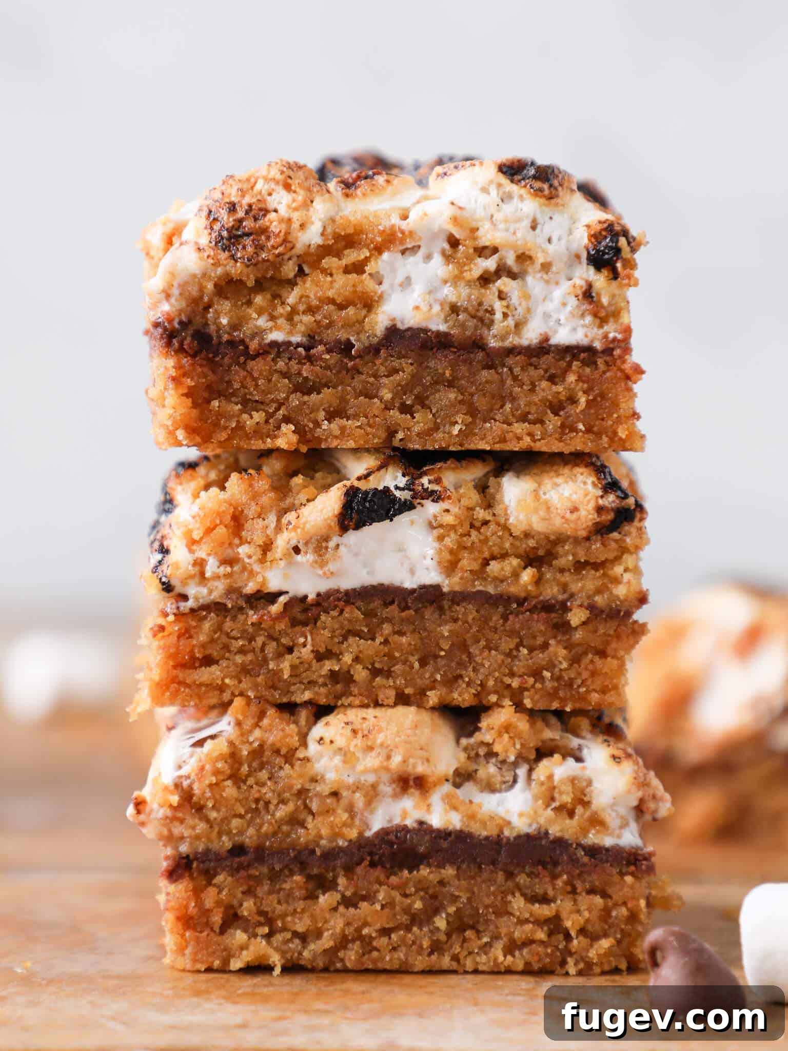 Ooey Gooey S'mores Crumble Bars 2 Stacked Soft Chewy S'mores Crumble Bars displaying their layered perfection