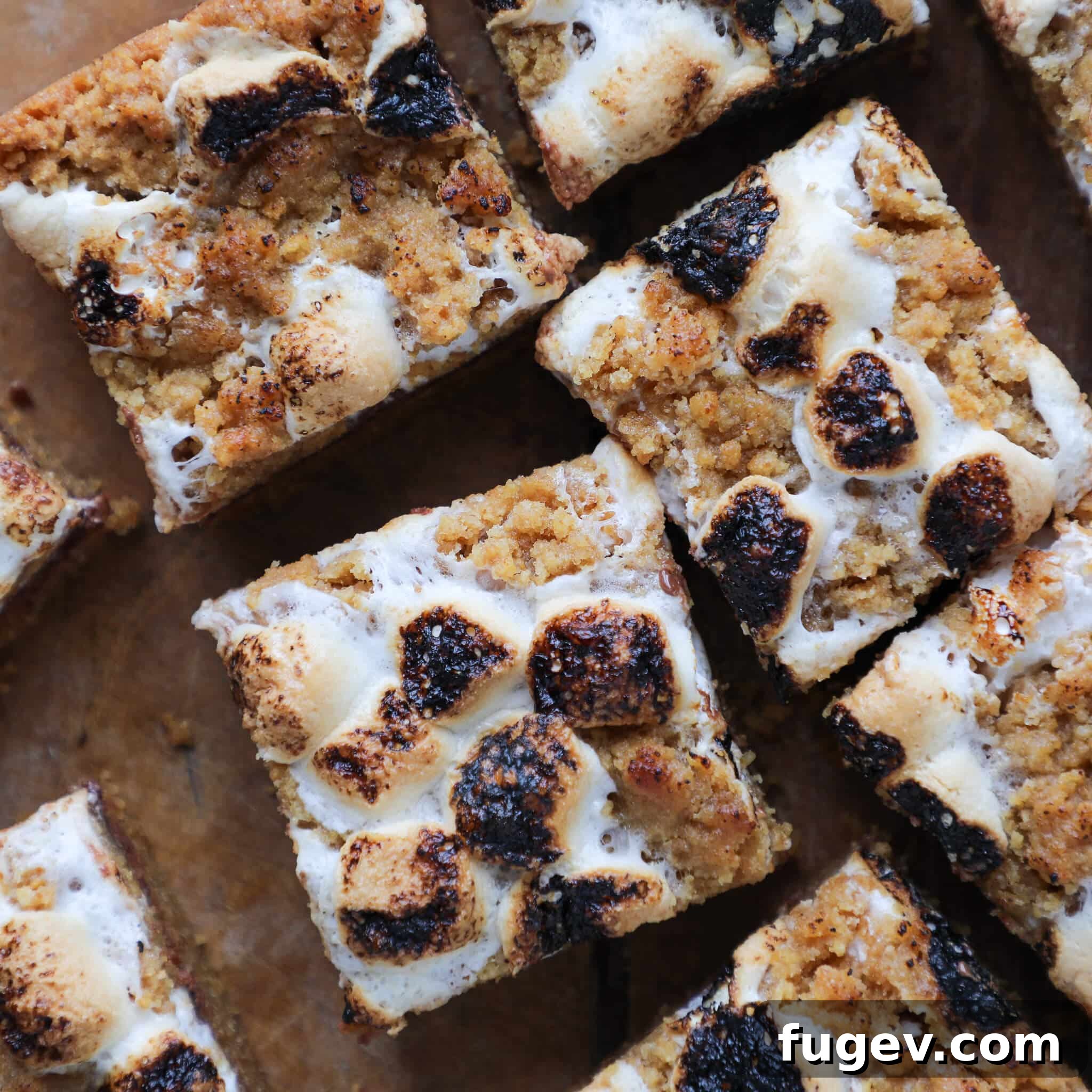 Ooey Gooey S'mores Crumble Bars 6 Close up top view of Soft Chewy S'mores Crumble Bars showcasing toasted marshmallows
