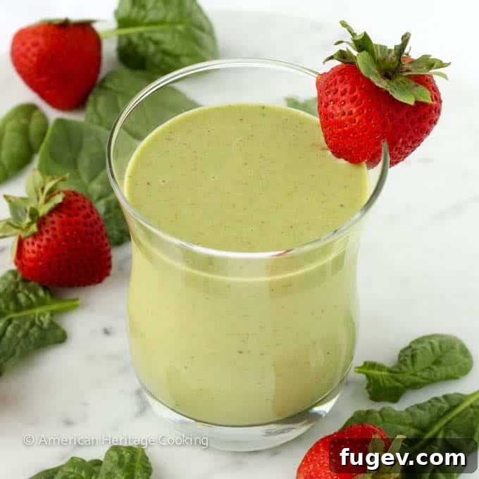 Sweet Green Power Smoothie 3 Close-up of a glass of Strawberry Banana Spinach Smoothie, showcasing its smooth, creamy texture.