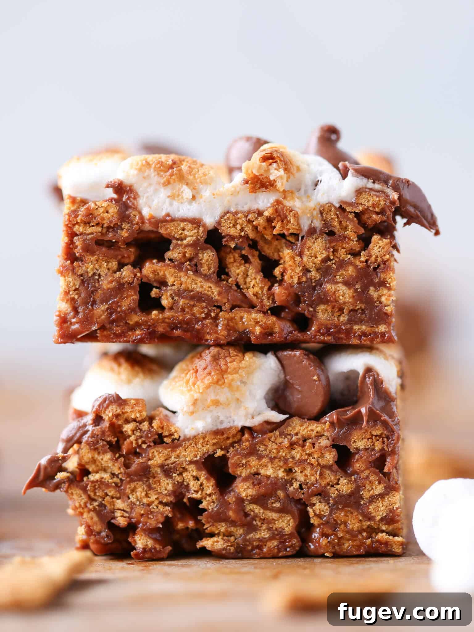 No Bake Golden Graham Smores Treats 3 No Bake Golden Graham Smores Bars sliced open, revealing the crunchy cereal and gooey marshmallow interior.