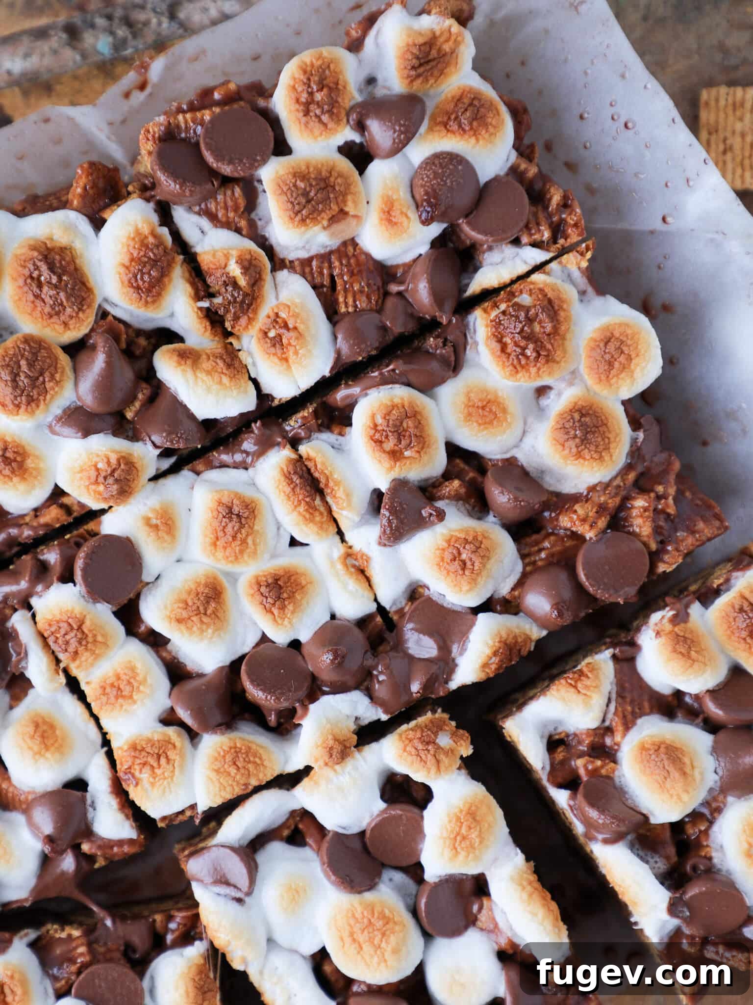 No Bake Golden Graham Smores Treats 5 No Bake Golden Graham Smores Bars neatly sliced and presented on parchment paper.