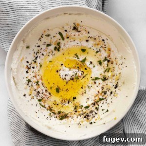 A bowl of creamy, homemade labneh, ready to be served.