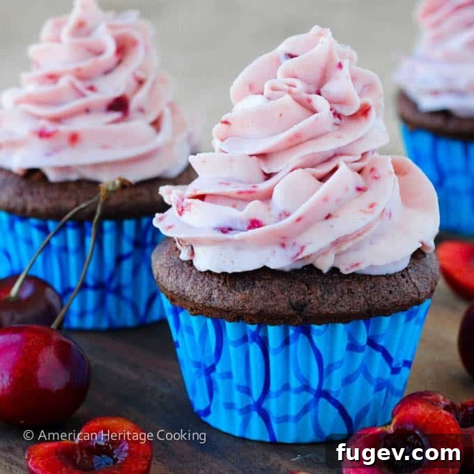 Velvet Double Chocolate Cherry Mascarpone Cupcakes 4 Double Chocolate Cupcakes with Cherry Mascarpone Frosting, showcasing the compote filling