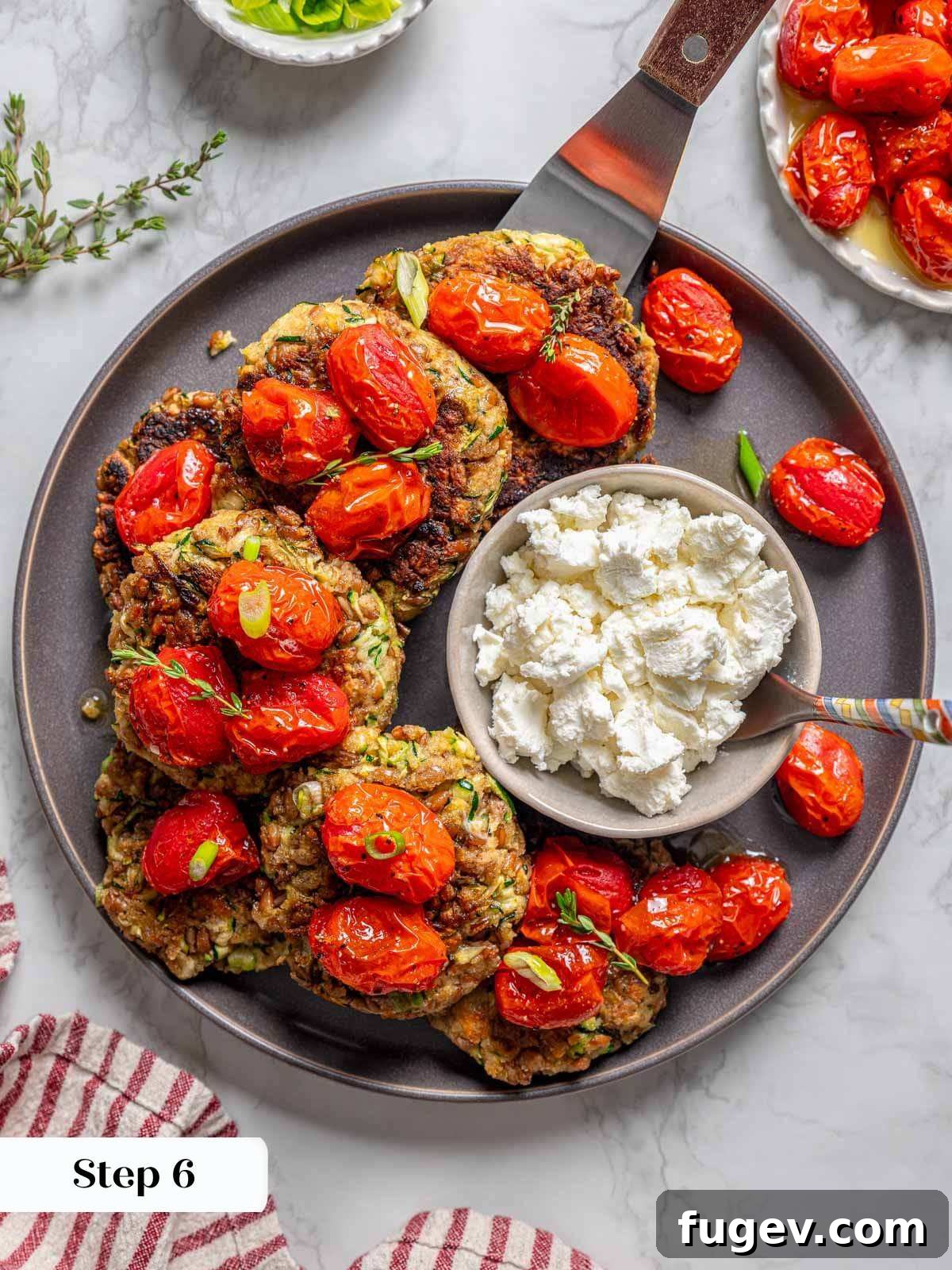 Golden Zucchini Fritters Delight 11 assembled zucchini fritters on grey plate with serving spatula.