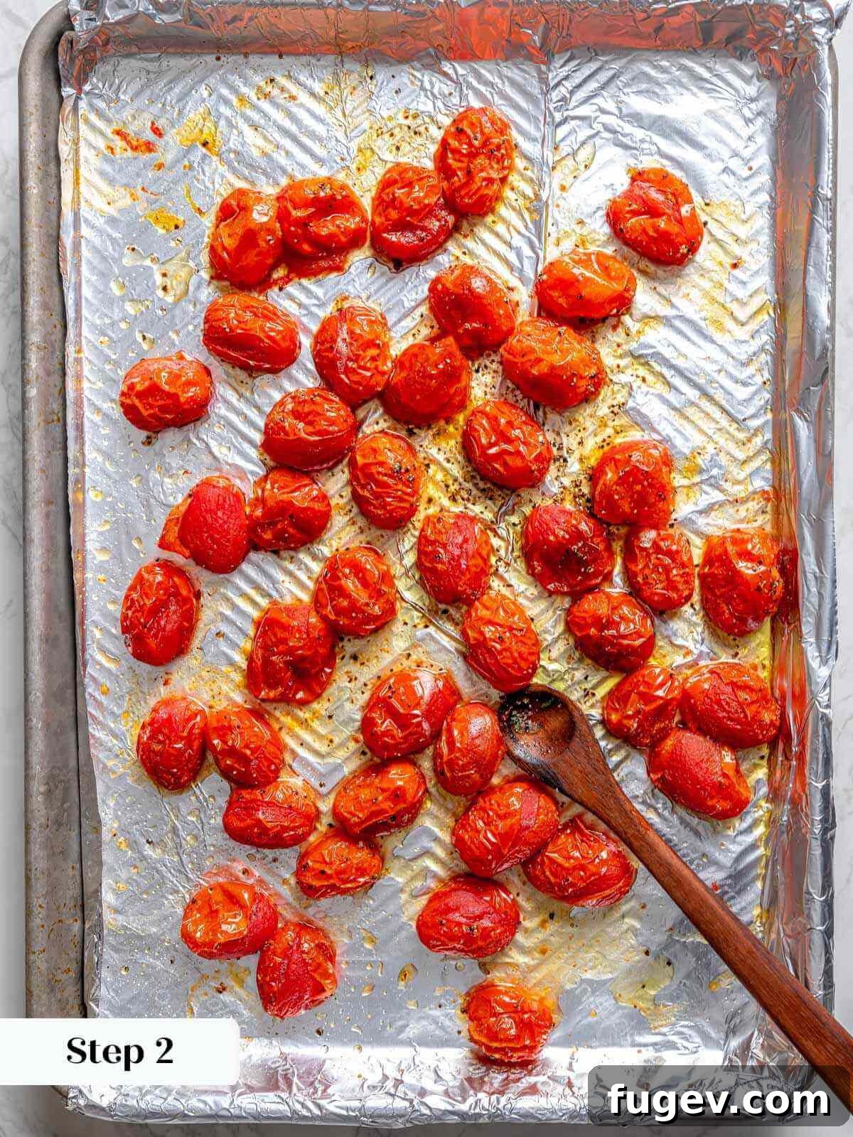 Golden Zucchini Fritters Delight 6 slow roasted tomatoes on foil lined baking sheet.