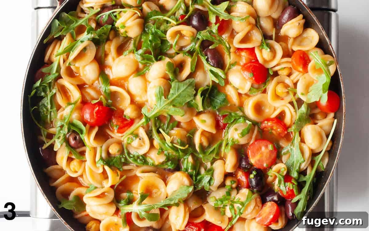 Mediterranean One Pan Orecchiette 5 Arugula, tomatoes and parmesan stirred into cooked pasta.