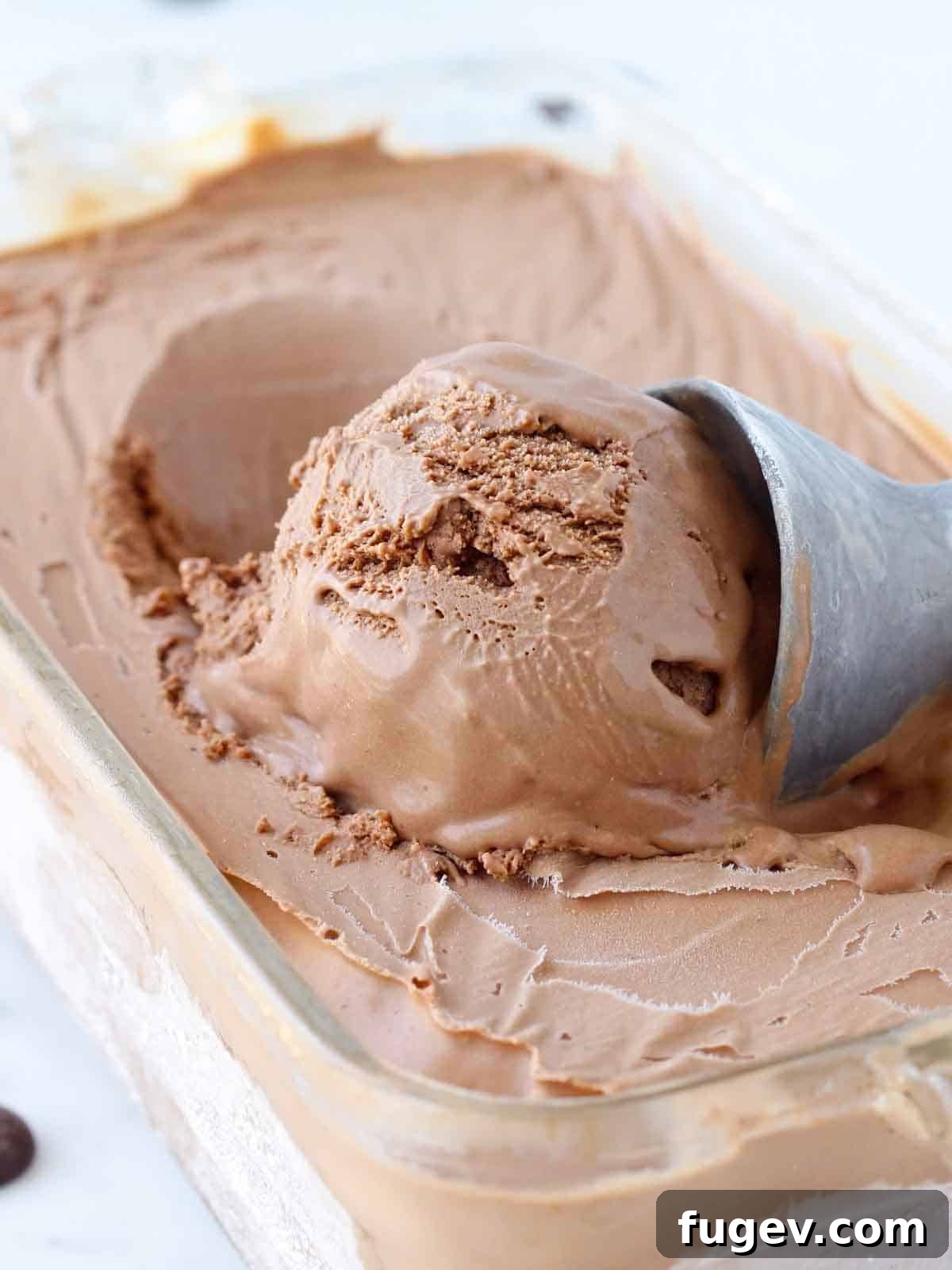 Decadent Chocolate Dream Ice Cream 2 A perfectly scooped ball of rich chocolate ice cream ready to be enjoyed.