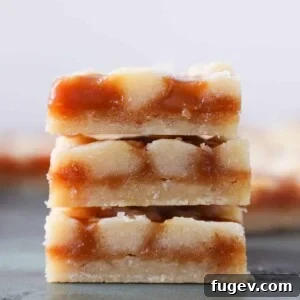 Stacked salted caramel butter bars with a close-up of the shortbread and caramel layers