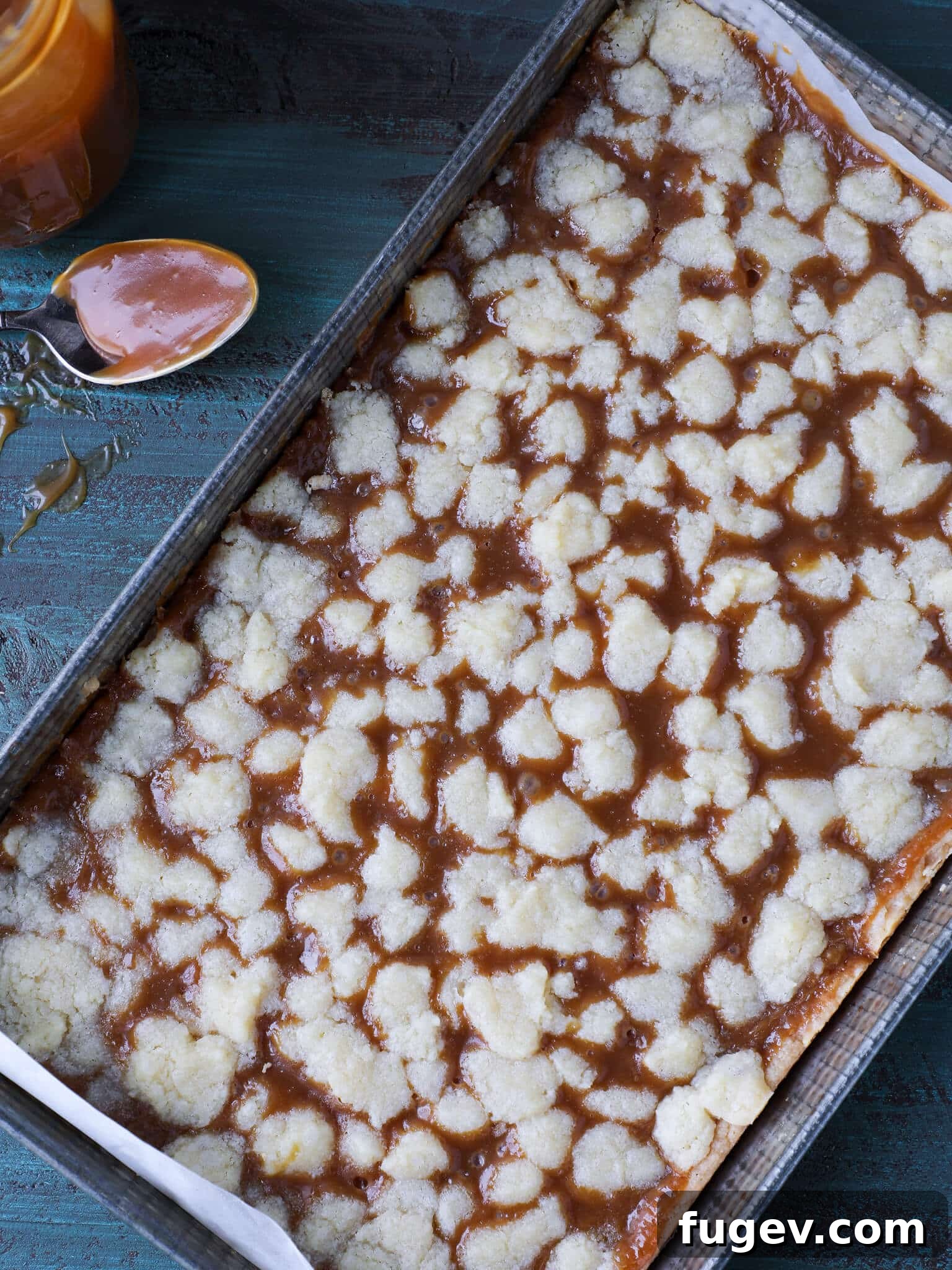 Salted Caramel Butter Bars 5 Uncut salted caramel butter bars in a vintage baking pan, showing the textured crumb topping