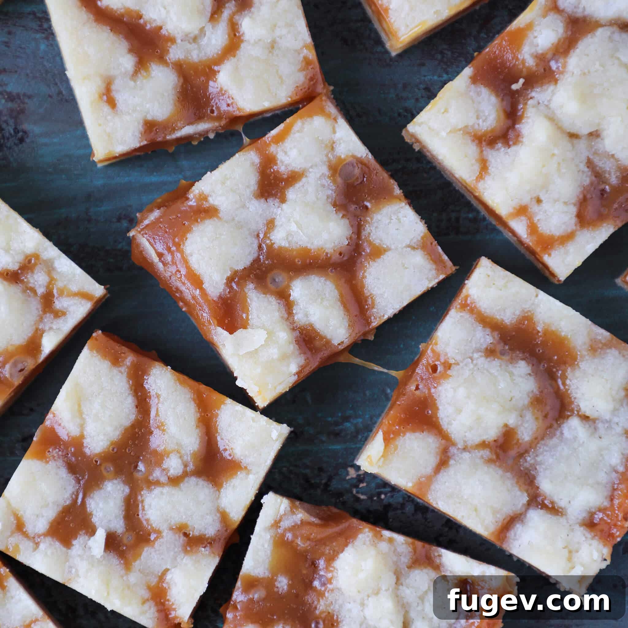 Salted Caramel Butter Bars 6 Salted Caramel Butter Bars showing a glorious caramel pull when sliced, indicating a gooey filling