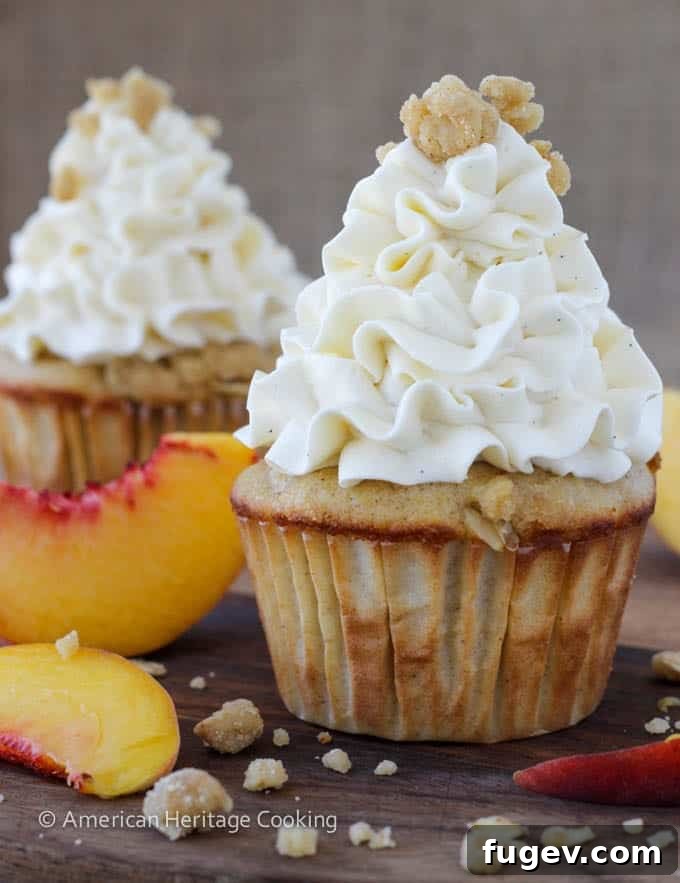 Summer Peach Crisp Cupcakes with Whipped Vanilla Swiss Meringue 2 Peach Crisp Cupcakes filled with peach compote and topped with Swiss meringue buttercream