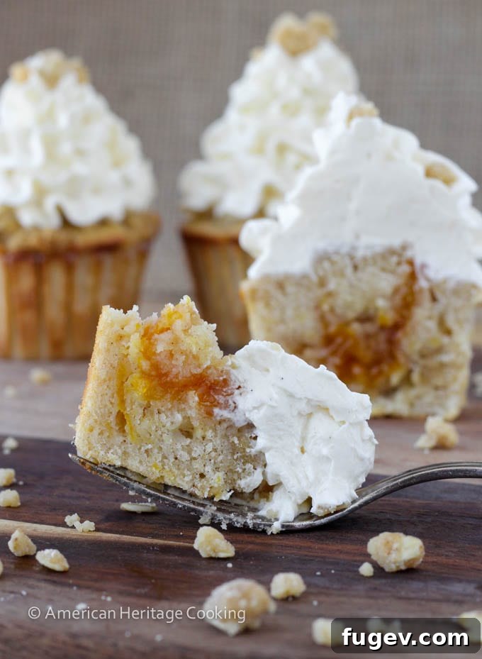 Summer Peach Crisp Cupcakes with Whipped Vanilla Swiss Meringue 3 Peach Crisp Cupcakes filled with peach compote and topped with Swiss meringue buttercream