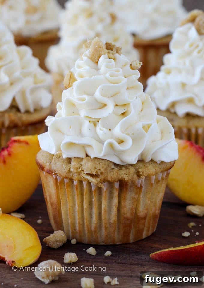 Summer Peach Crisp Cupcakes with Whipped Vanilla Swiss Meringue 4 Peach Crisp Cupcakes filled with peach compote and topped with Swiss meringue buttercream
