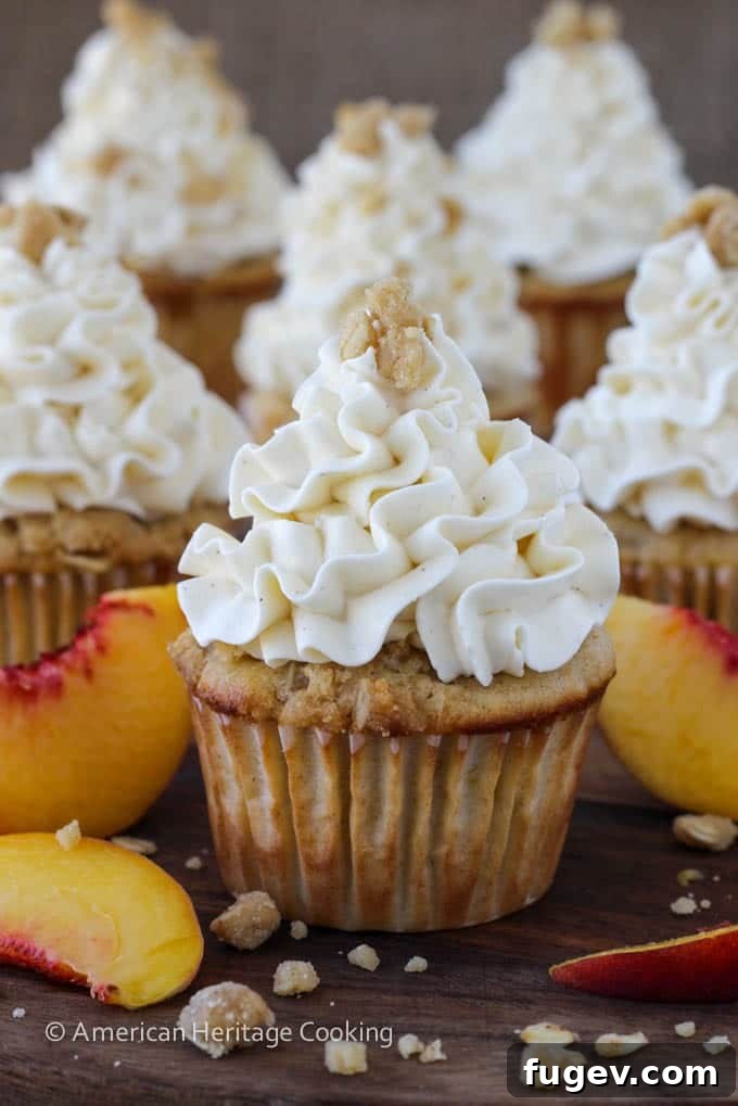 Summer Peach Crisp Cupcakes with Whipped Vanilla Swiss Meringue 6 Peach Crisp Cupcakes filled with peach compote and topped with Swiss meringue buttercream