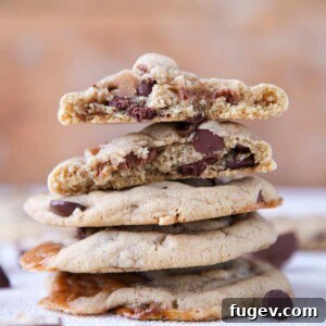 Caramel Stuffed Brown Butter Snickers Chocolate Chip Cookies stacked interior detail