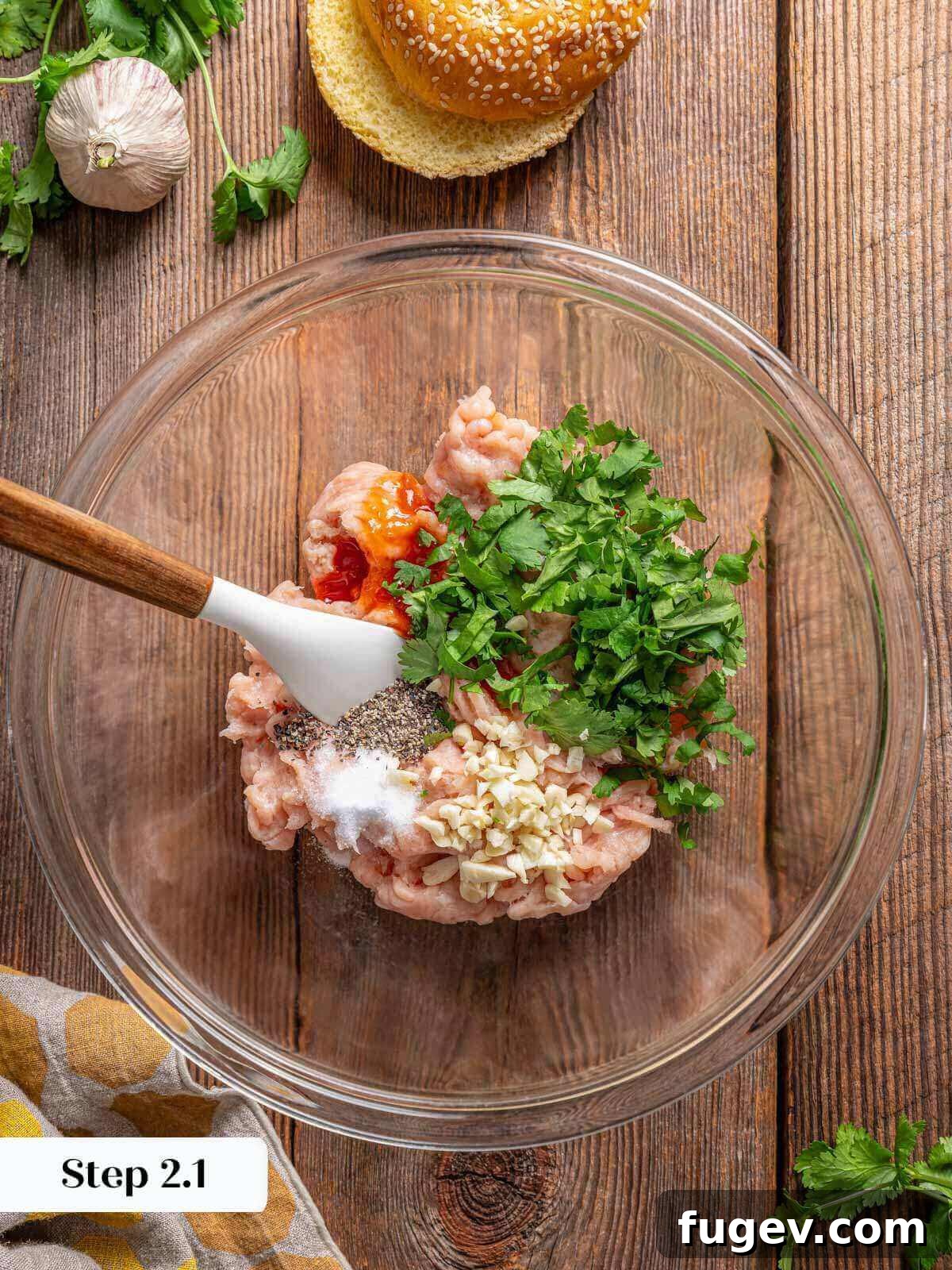 Succulent Chicken Burgers 5 Ground chicken and spices in a bowl, ready to be mixed for burger patties.
