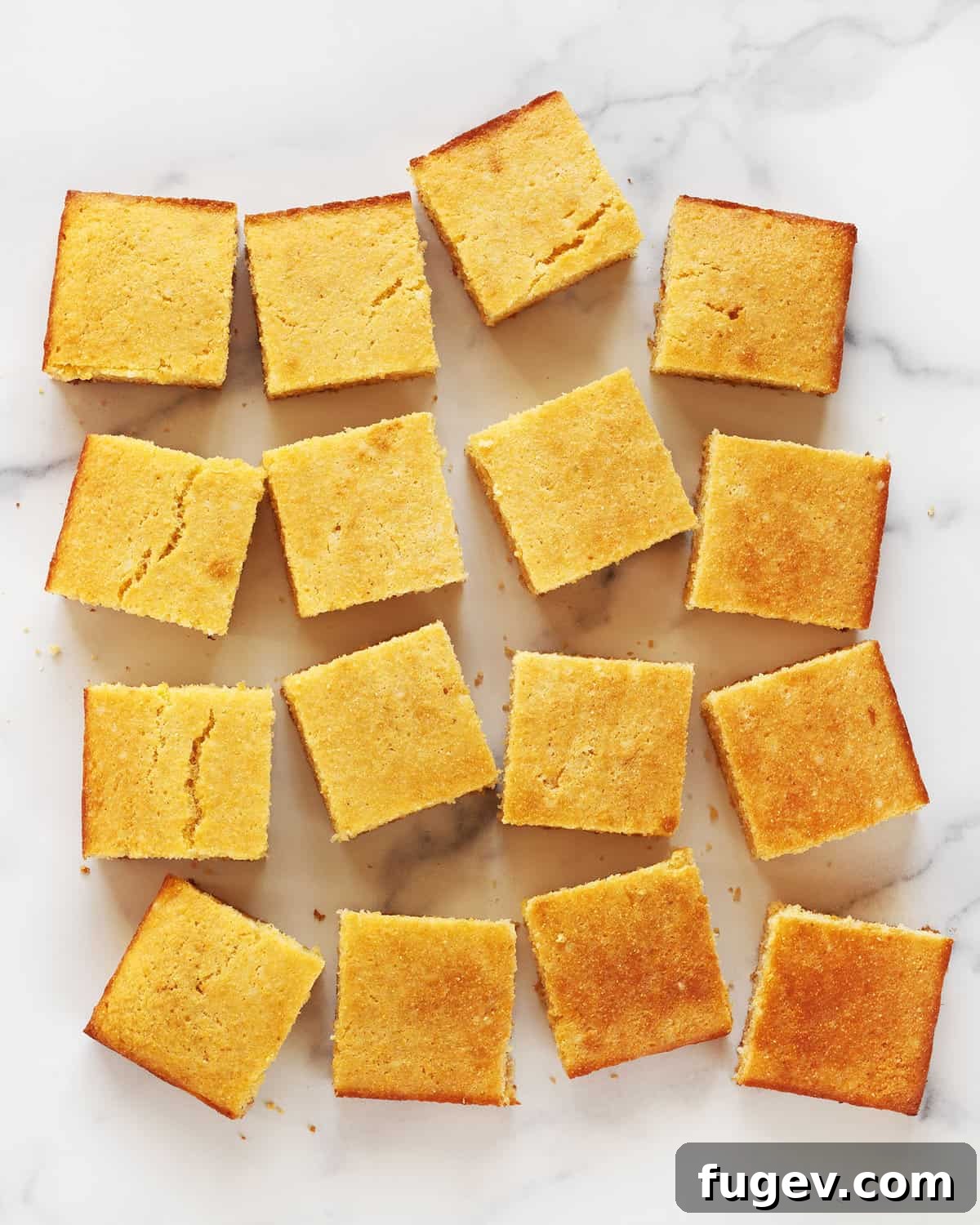 Southern Comfort Buttermilk Cornbread 7 Perfectly baked buttermilk cornbread cut into neat squares and artfully arranged in rows on a serving platter.