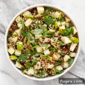 20 Fresh & Festive Thanksgiving Salad Recipes 17 Pear farro salad in a bowl.