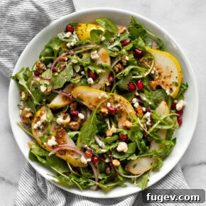 20 Fresh & Festive Thanksgiving Salad Recipes 5 Pear salad on a plate.
