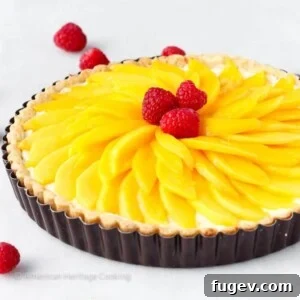 Coconut Mango Tart with artistically sliced mango topping