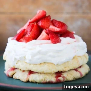 Old Fashioned Strawberry Shortcake, unsliced on a green plate