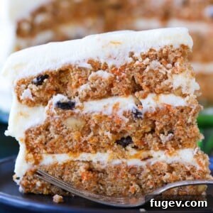 Close-up of a delicious carrot cake slice with cream cheese frosting