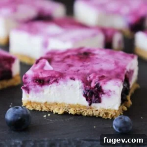 No Bake Blueberry Cheesecake Bars, a perfect slice showcasing layers