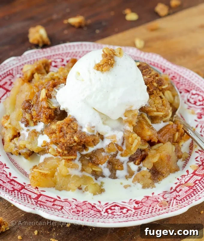 Effortless Summer Sweet Treats 28 Apple crisp on a vintage red plate with melted vanilla ice cream
