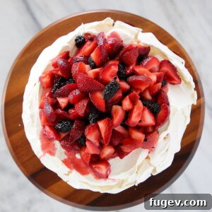 The best pavlova dessert with lemon curd and fresh mixed berries
