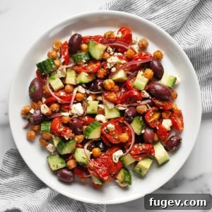The finished roasted Greek chickpea salad, perfectly tossed and ready to serve.