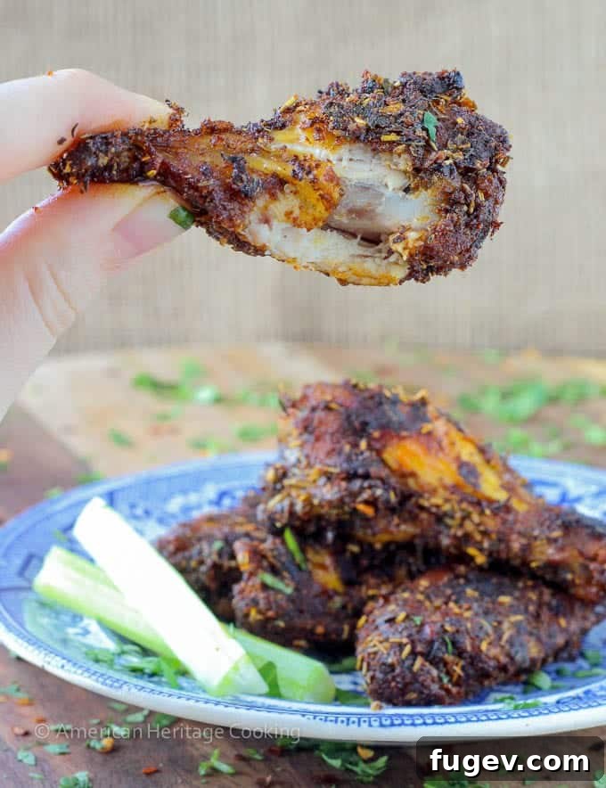 Crispy Baked Spice Medley Wings 3 Close-up of baked chicken wings on a serving platter, showing the crispy skin and flavorful rub