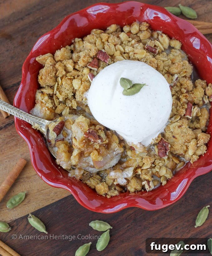 Fragrant Cardamom Pear Crumble 3 Close-up shot of a warm Cardamom Pear Crisp, showcasing the bubbling fruit filling and crumbly topping.