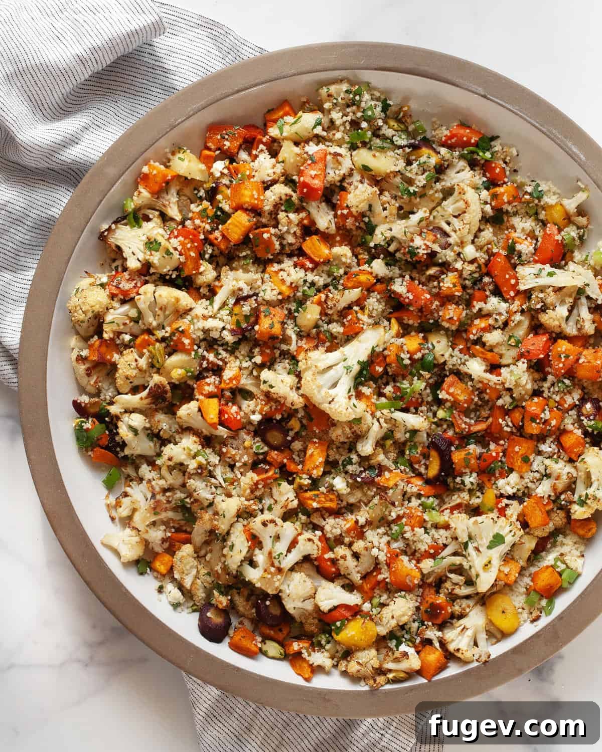 Warm Roasted Harvest Salad 2 Roasted vegetable salad in a bowl, showcasing vibrant colors and textures.