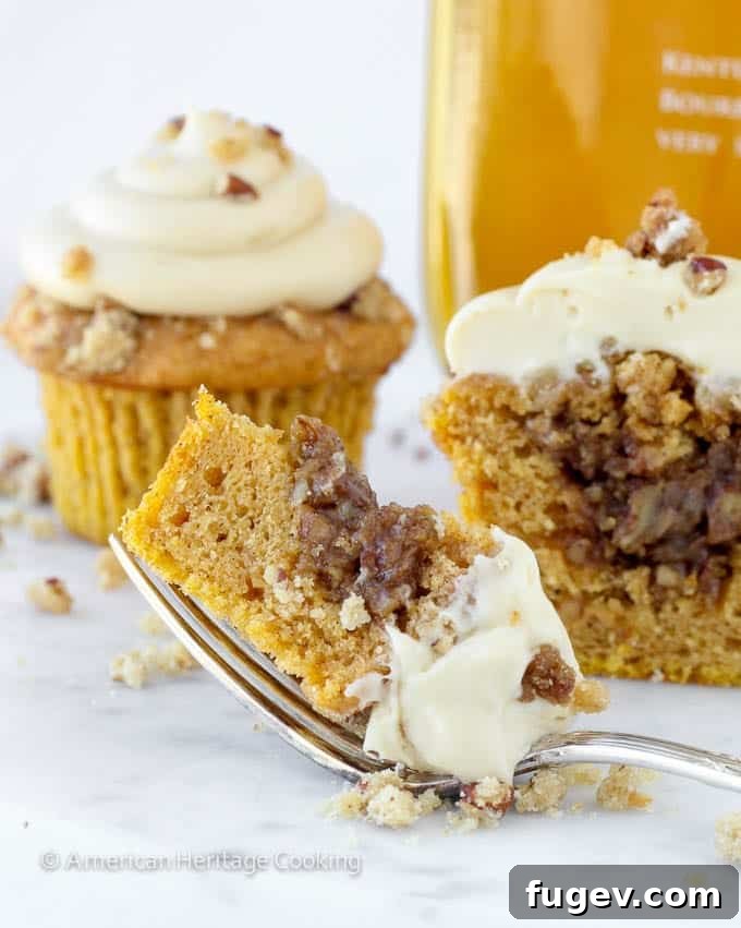 Toasted Pecan Pumpkin Pie Cupcakes 5 Multiple Pumpkin Pecan Pie Cupcakes arranged on a serving plate.