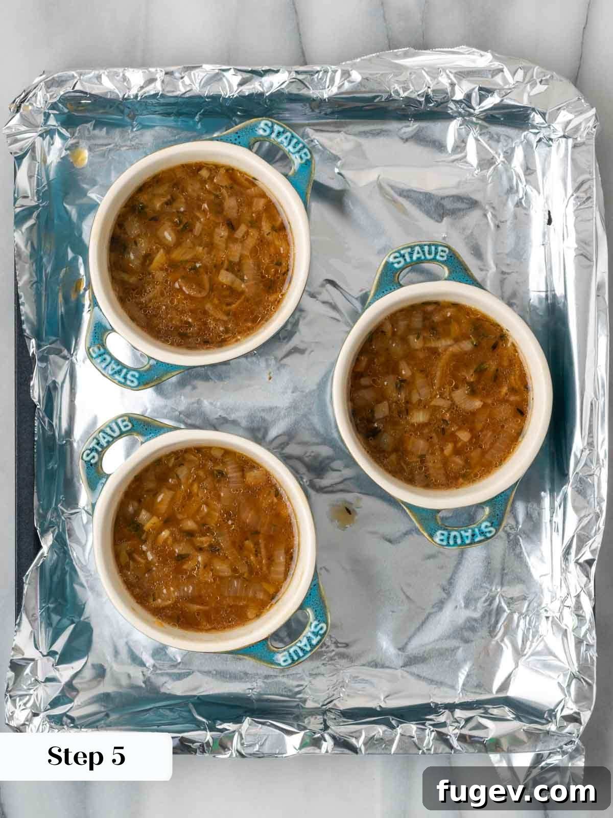 The Quintessential French Onion 8 portioning onion soup into ramekins.