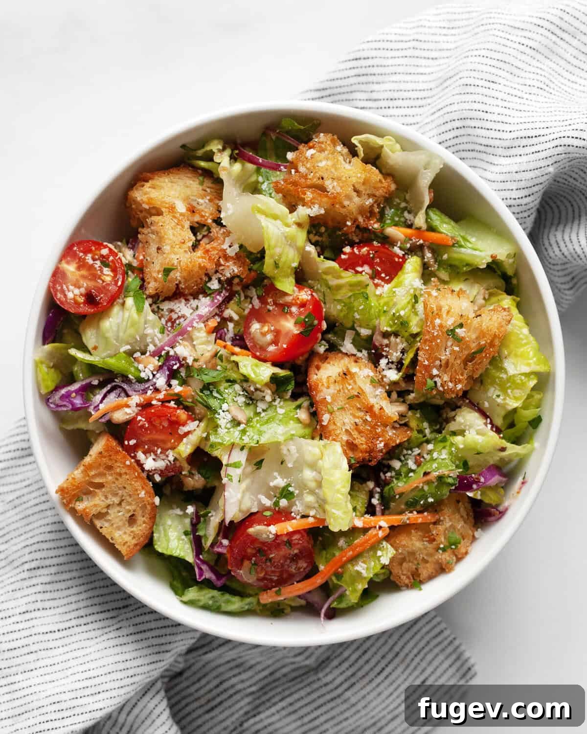 Garden Fresh Salad 7 A small bowl of vibrant, fresh house salad, showcasing its colorful ingredients and inviting texture.