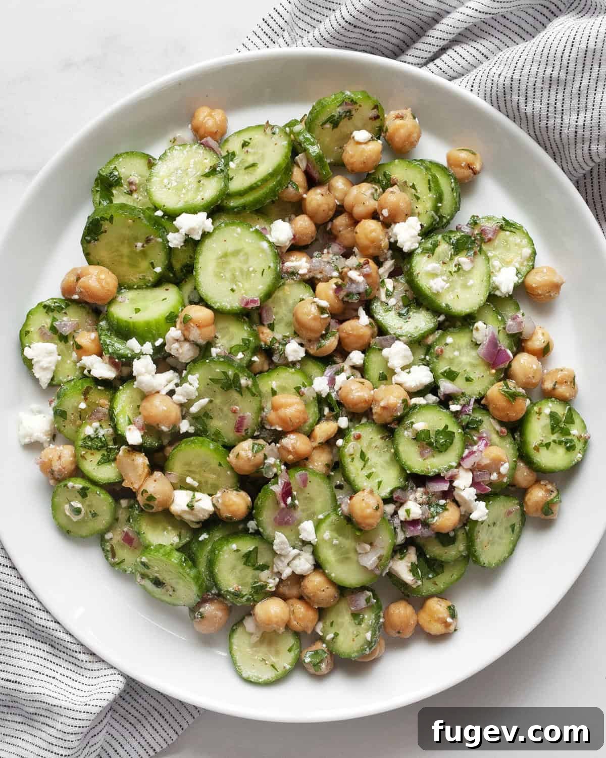 Mediterranean Chickpea Cucumber Refresh 2 A vibrant chickpea cucumber salad served on a plate, highlighting its fresh ingredients.