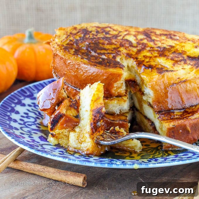 Pumpkin Spice French Toast: An easy holiday breakfast for two, garnished with powdered sugar