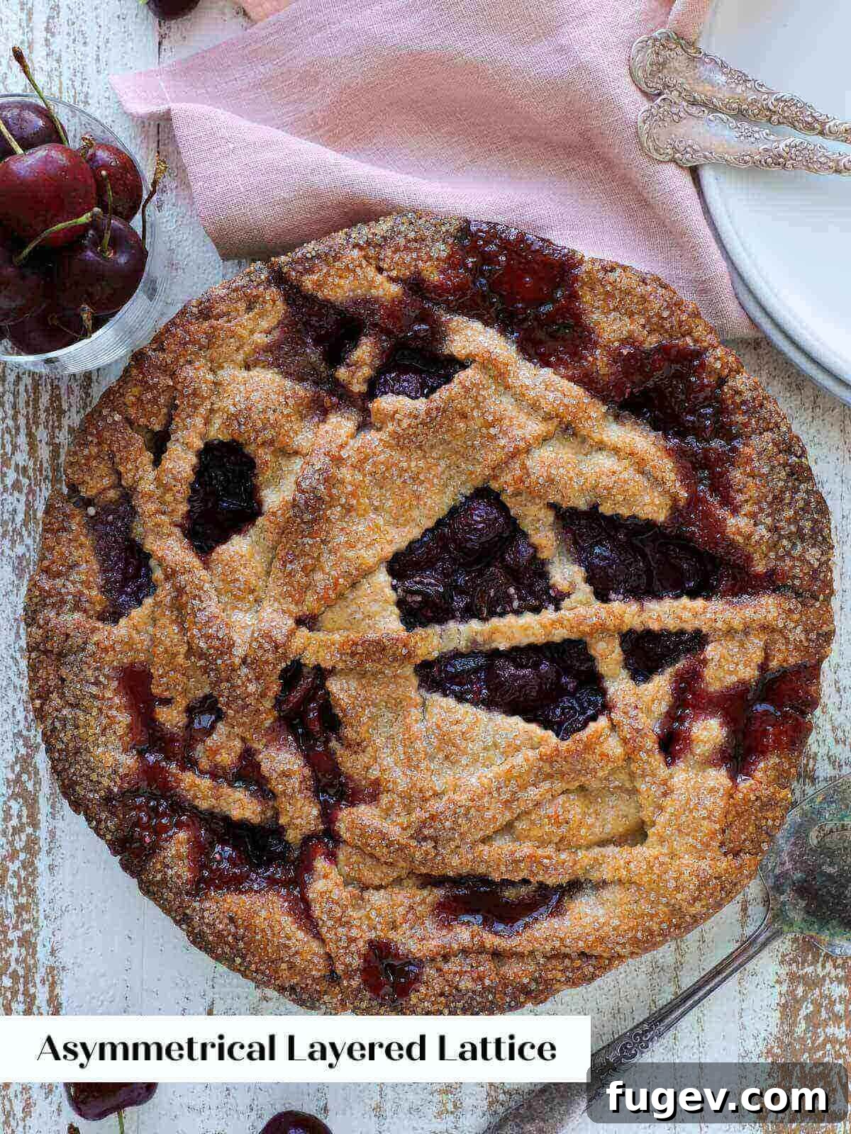 The Art of the Perfect Pie Lattice 11 A beautifully baked pie featuring an asymmetrical layered lattice crust, showcasing a modern and artistic approach to pie topping.