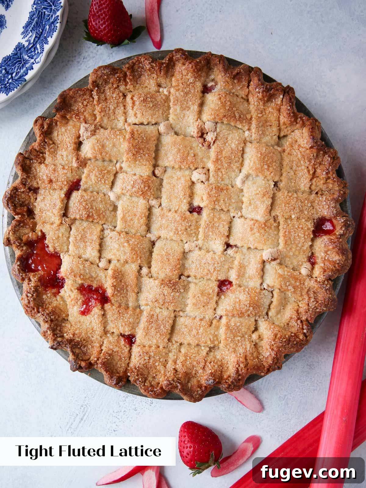 The Art of the Perfect Pie Lattice 12 A perfectly baked pie topped with a symmetrical fluted lattice crust, highlighting elegant decorative edges on each strip.