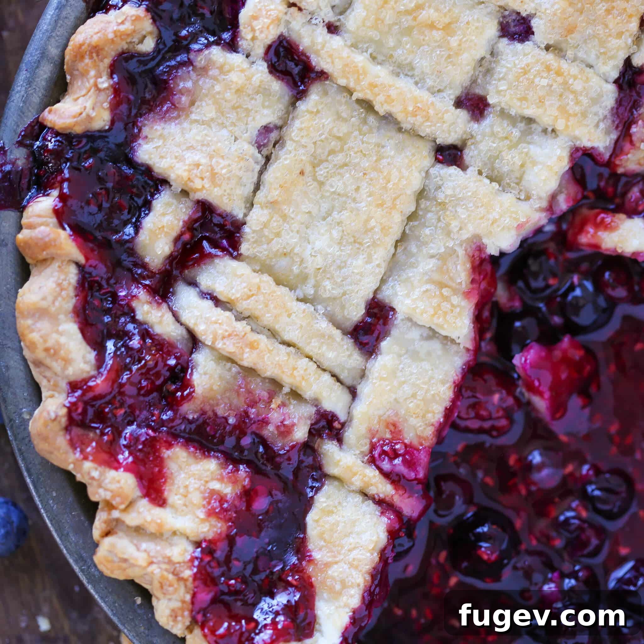 The Art of the Perfect Pie Lattice 3 A beautifully baked Mixed Berry Pie with a golden-brown lattice top, showcasing the attractive woven crust.