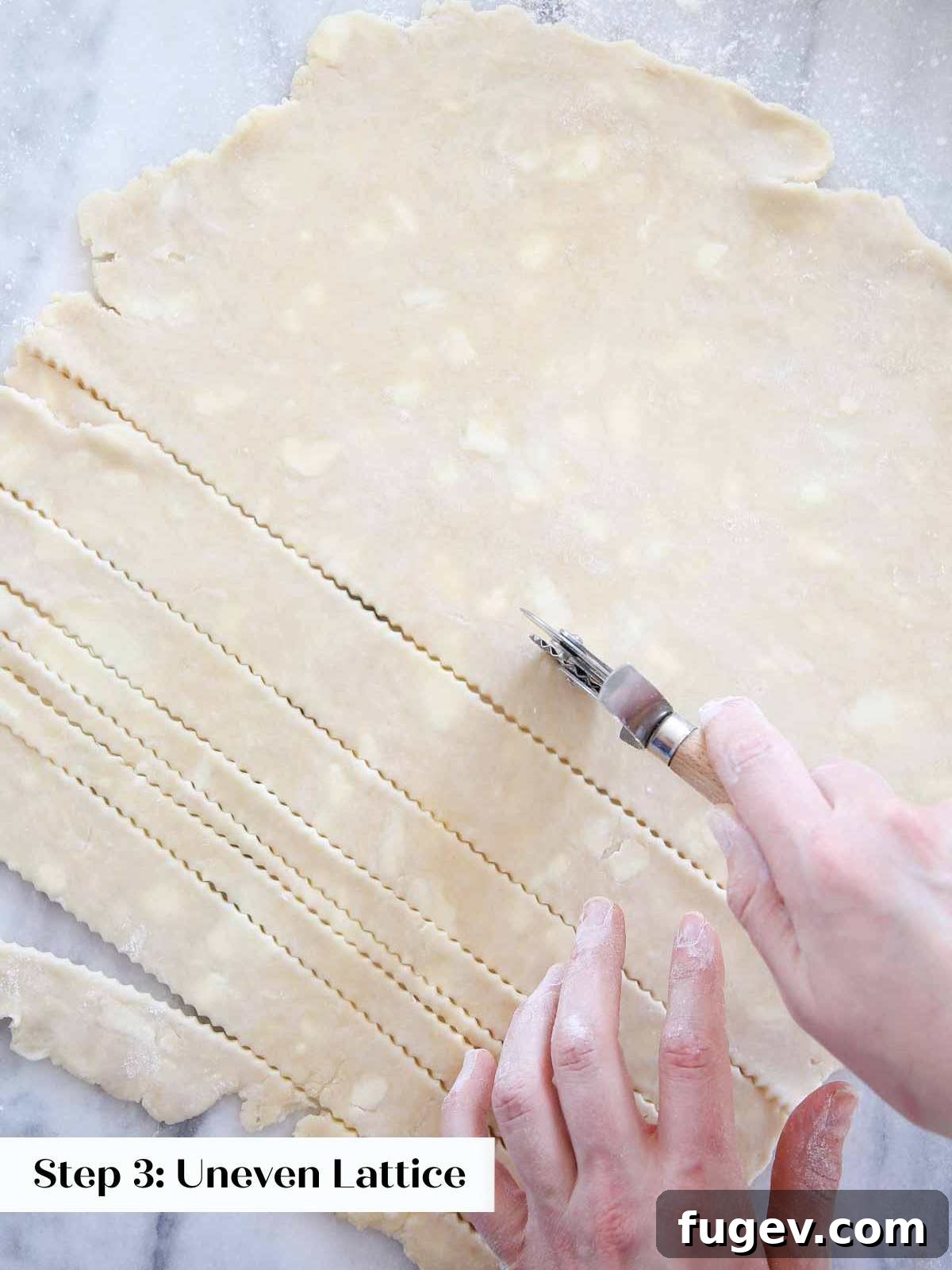 The Art of the Perfect Pie Lattice 5 Hand cutting butter pie dough into precise strips using a pizza cutter, essential for a traditional lattice.