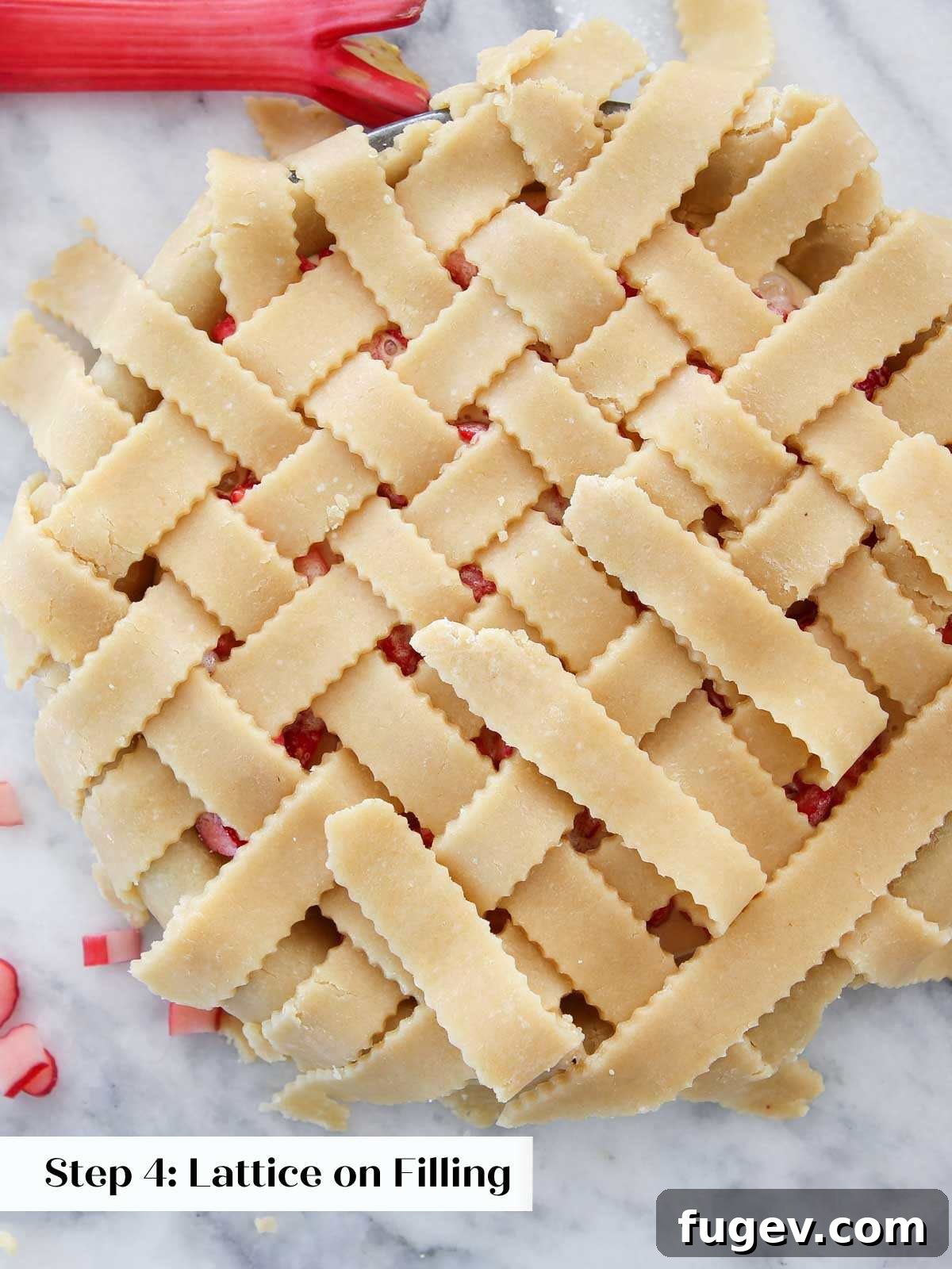 The Art of the Perfect Pie Lattice 7 A close-up shot of a pastry chef carefully latticing pie dough directly on an assembled pie, showing the intricate weaving process.