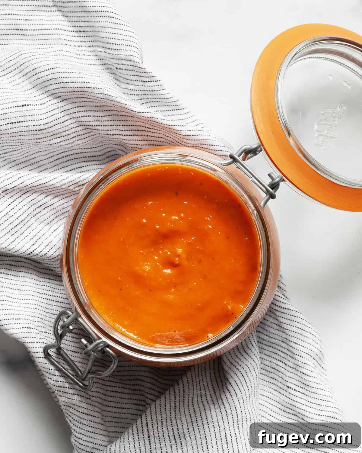 Bursting Roasted Cherry Tomato Sauce 2 Roasted cherry tomato sauce in a jar, ready for storage or serving.