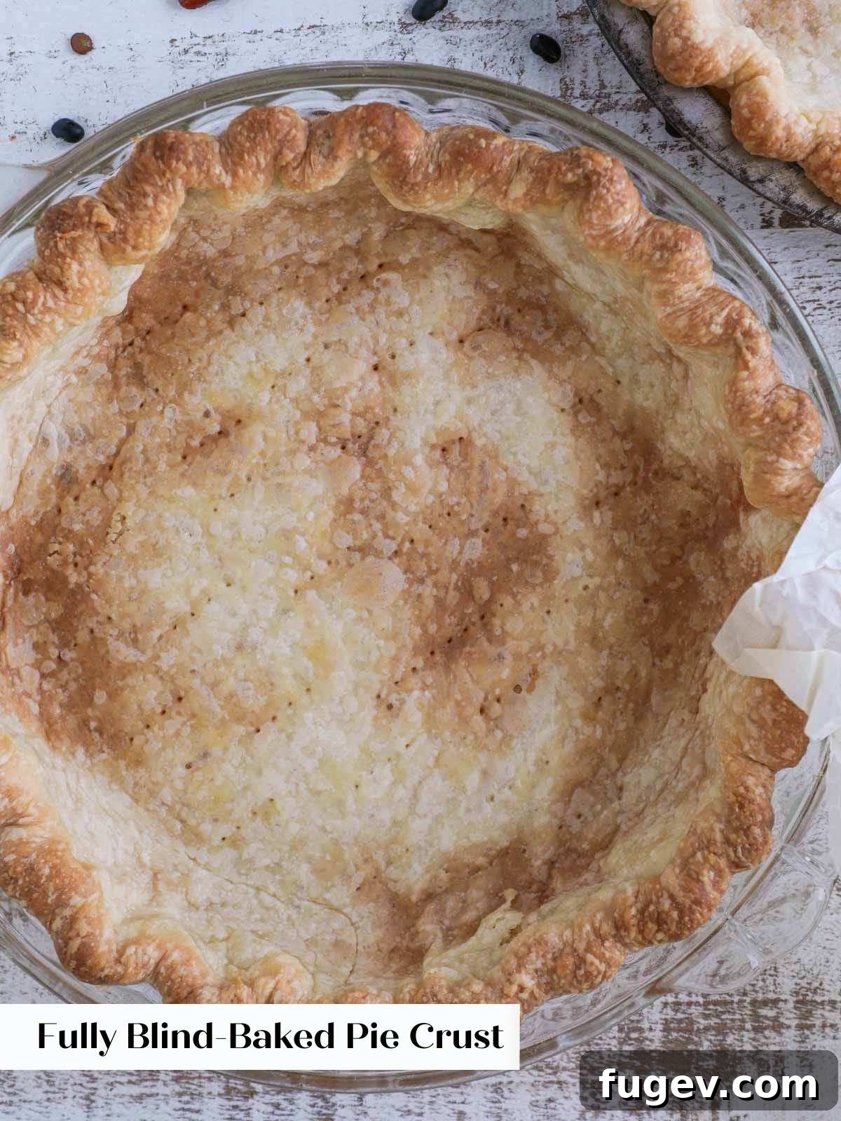 Pre-Bake Perfection: A Guide to Crisp Pie Crusts 11 A fully blind-baked pie crust, displaying a beautiful golden-brown color and a crisp, perfect texture.