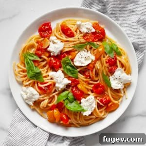 Roasted tomato burrata pasta on a plate.