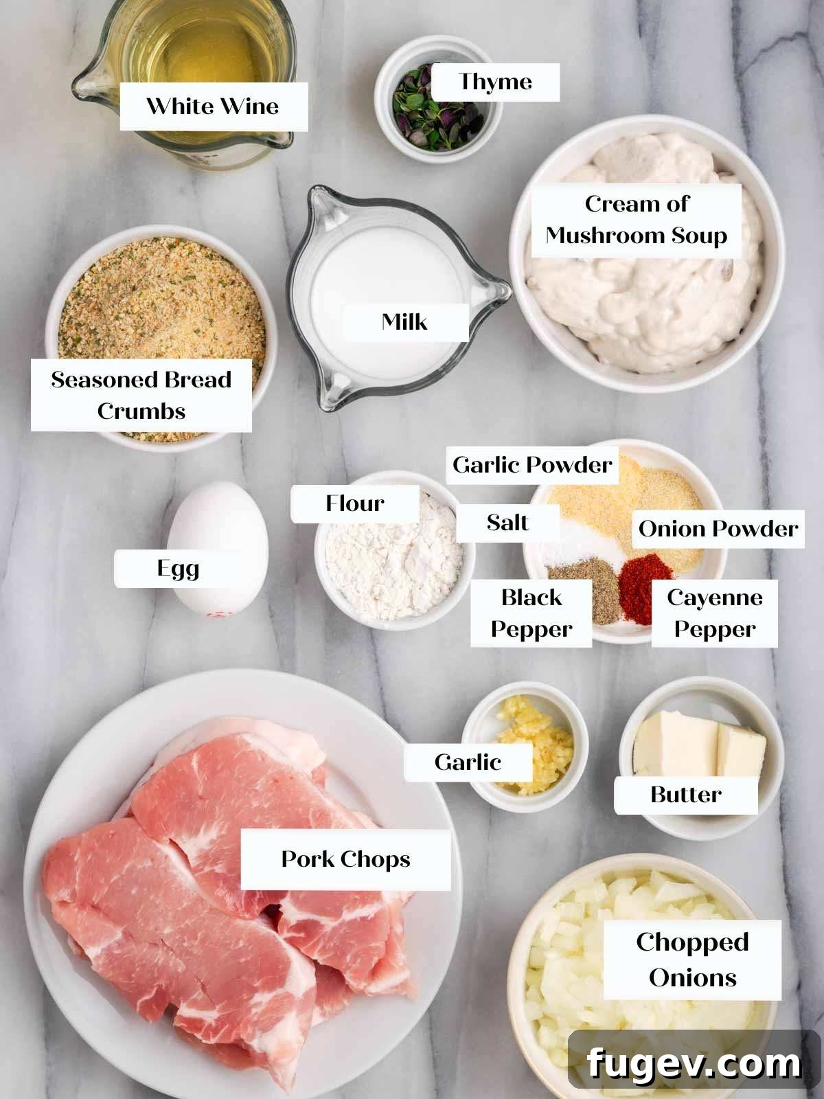 Creamy Mushroom Pork Chops 4 All ingredients for baked pork chops with cream of mushroom soup laid out on a marble surface.