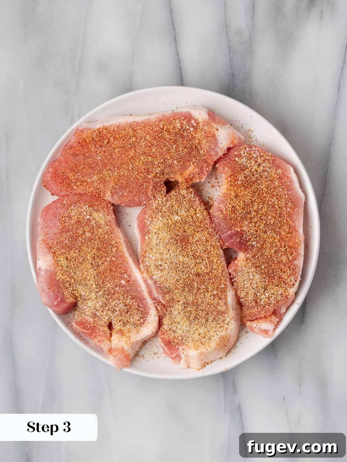 Creamy Mushroom Pork Chops 7 Pork chops seasoned generously with a blend of onion powder, garlic powder, cayenne pepper, salt, and black pepper.